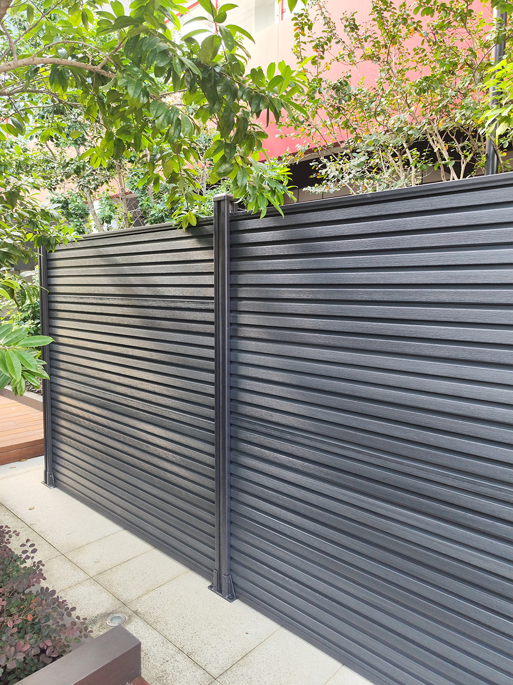 Fencly Privacy Fence — zero-gap 180mm WPC composite boards blocking sightlines and street noise along a townhouse boundary.